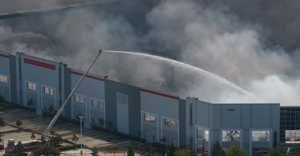 Firefighters attempt to extinguish a fire at the Kimberly-Clark paper products facility.
