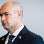 Rep. Greg Landsman stands looking to the side.