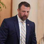 Markwayne Mullin walks.